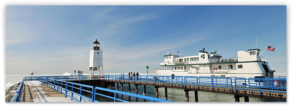 The Emerald Isle passing the Charlevoix Pier Lighthouse