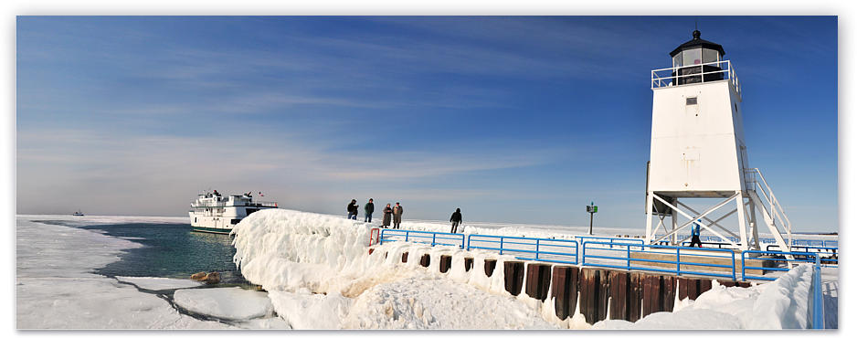 Onlookers gathered on the Charlevoix Pier to wave to the Emerald Isle as she passes for this early winter run in March